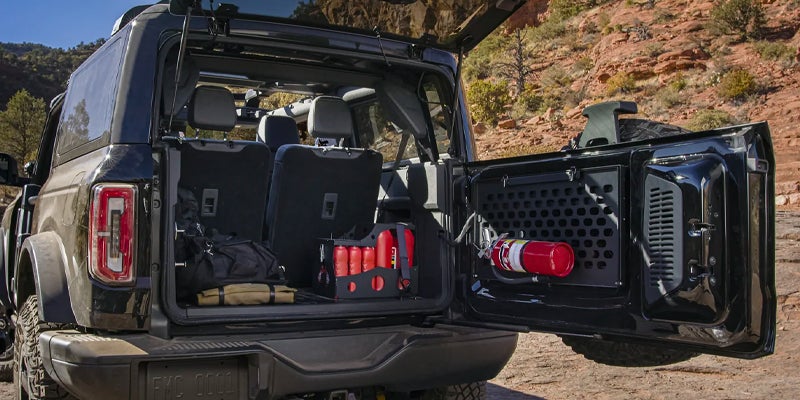 Back door of Ford Bronco is open.