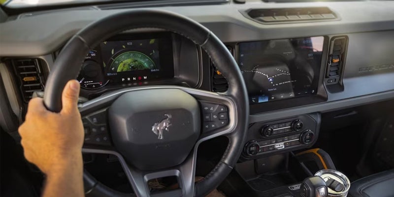 Interior of Ford Bronco like stearing, dashboard is displayed.