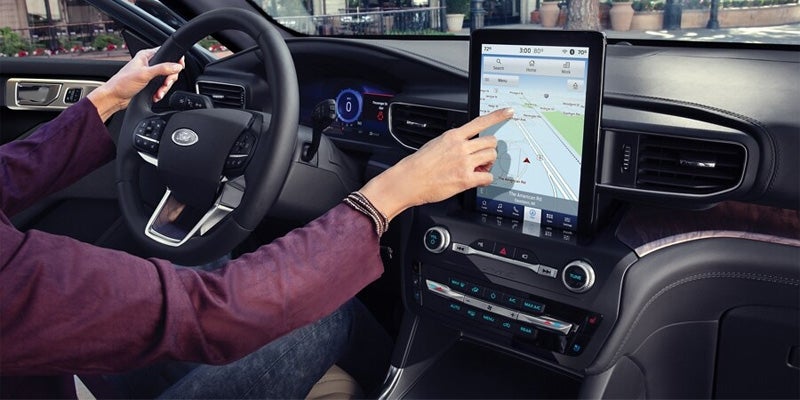 Ford Explorer touchscreen is displayed.